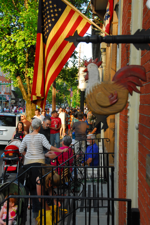 Crowded street of Lititz showing sidewalk jammed with people shopping